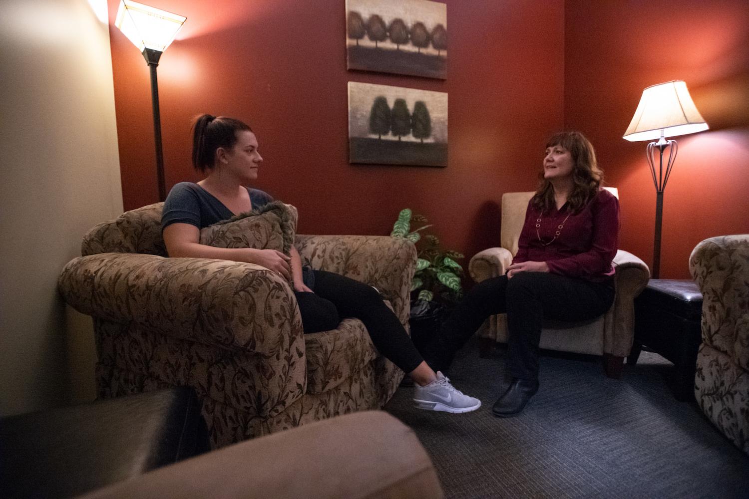A counselor having a conversation with a woman